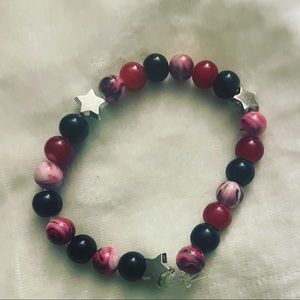 Handmade new red and black beaded elastic bracelet with silver star charms